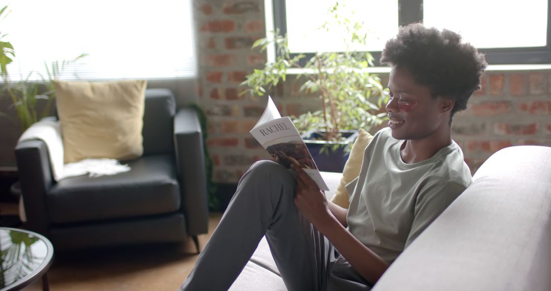Relaxed African American Man Reading at Home with Eye Patches