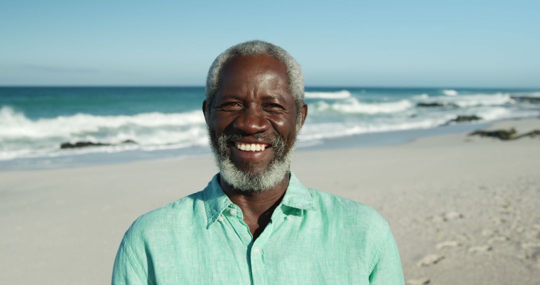 Smiling Elderly Man Enjoying Beach Vacation - Free Images, Stock Photos and Pictures on Pikwizard.com