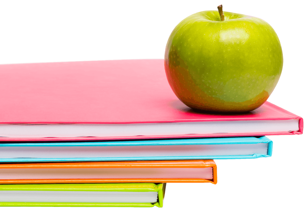 Green Apple Resting on Brightly Colored Notebooks Transparent Background