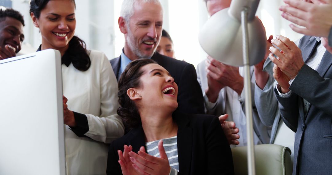 Diverse Team Applauding Female Colleague in Office - Free Images, Stock Photos and Pictures on Pikwizard.com