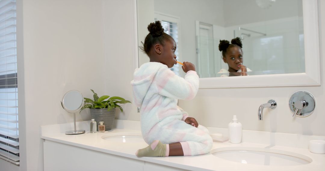 Little Girl Brushing Teeth on Bathroom Counter - Free Images, Stock Photos and Pictures on Pikwizard.com