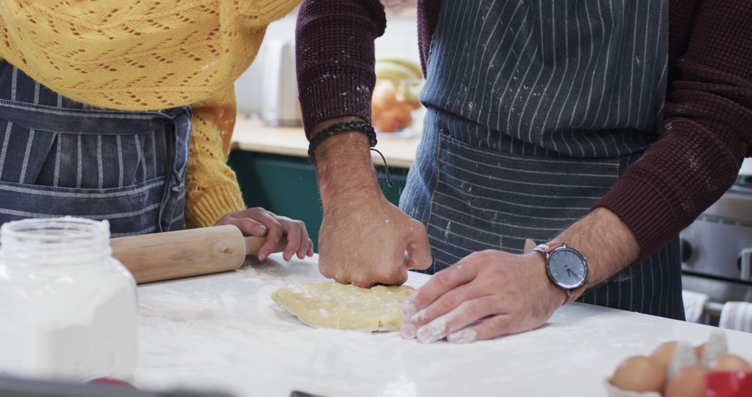 Couple Preparing Dough Together in Kitchen - Free Images, Stock Photos and Pictures on Pikwizard.com