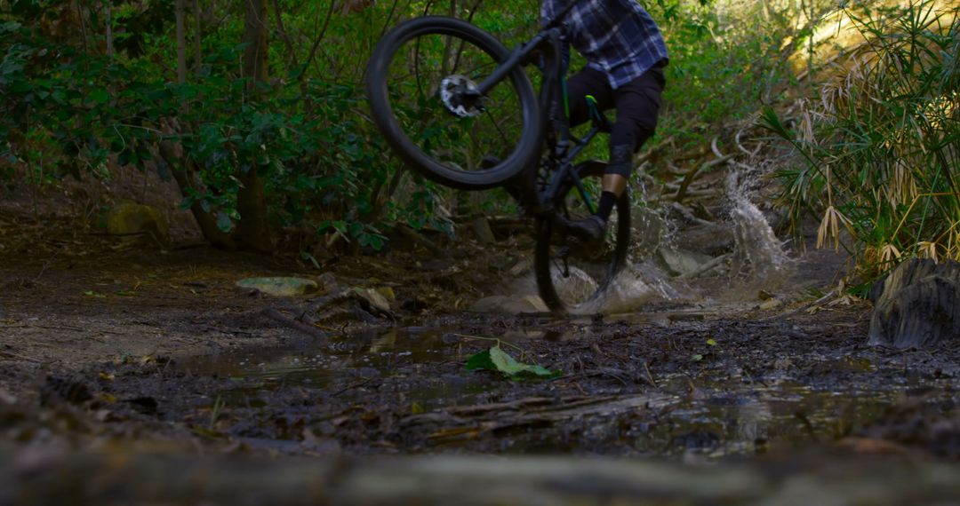 Mountain Biking Adventure on Muddy Trail with Speed and Adrenaline