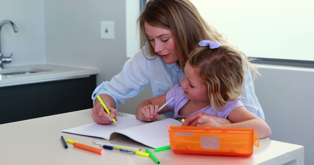 Mother and Daughter Drawing Together in Cozy Kitchen - Free Images, Stock Photos and Pictures on Pikwizard.com