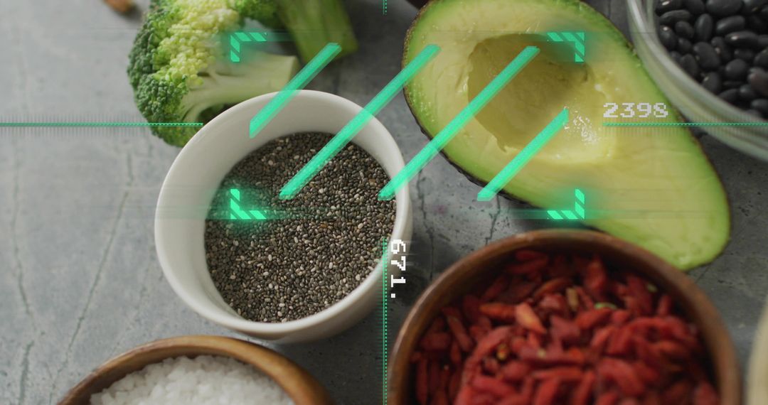 Chia seeds bowl surrounded by avocado, broccoli and superfoods with green digital overlay