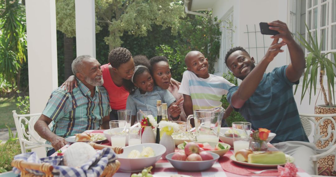 African American Family Taking Selfie at Outdoor Meal Gathering - Free Images, Stock Photos and Pictures on Pikwizard.com