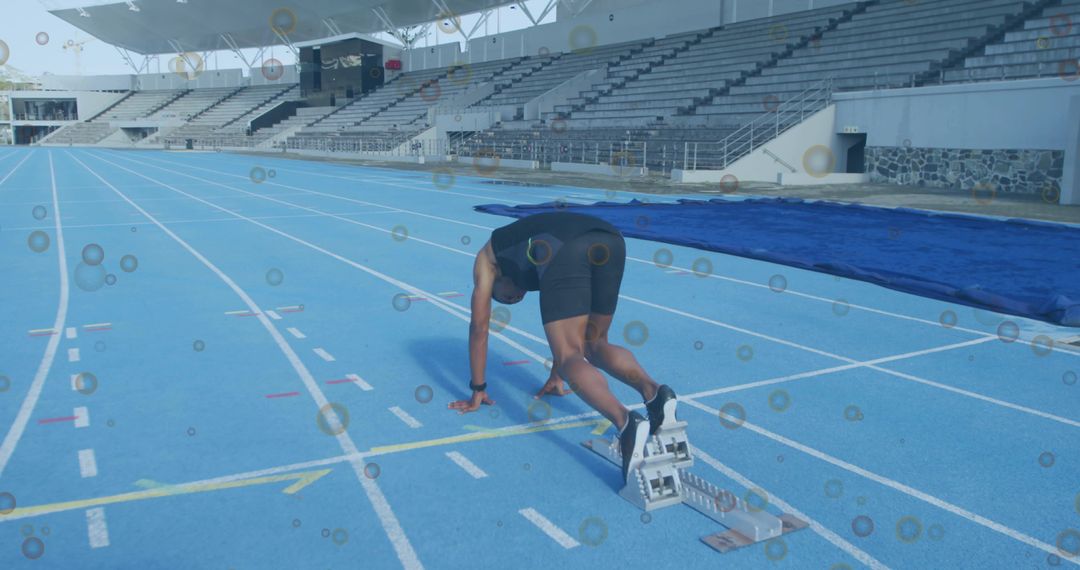 Male Sprinter Launching at Stadium Start