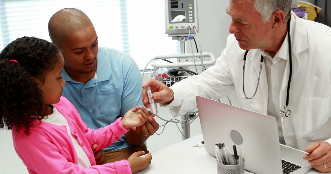 Doctor Giving Medical Advice to Child with Parent in Examination Room - Free Images, Stock Photos and Pictures on Pikwizard.com