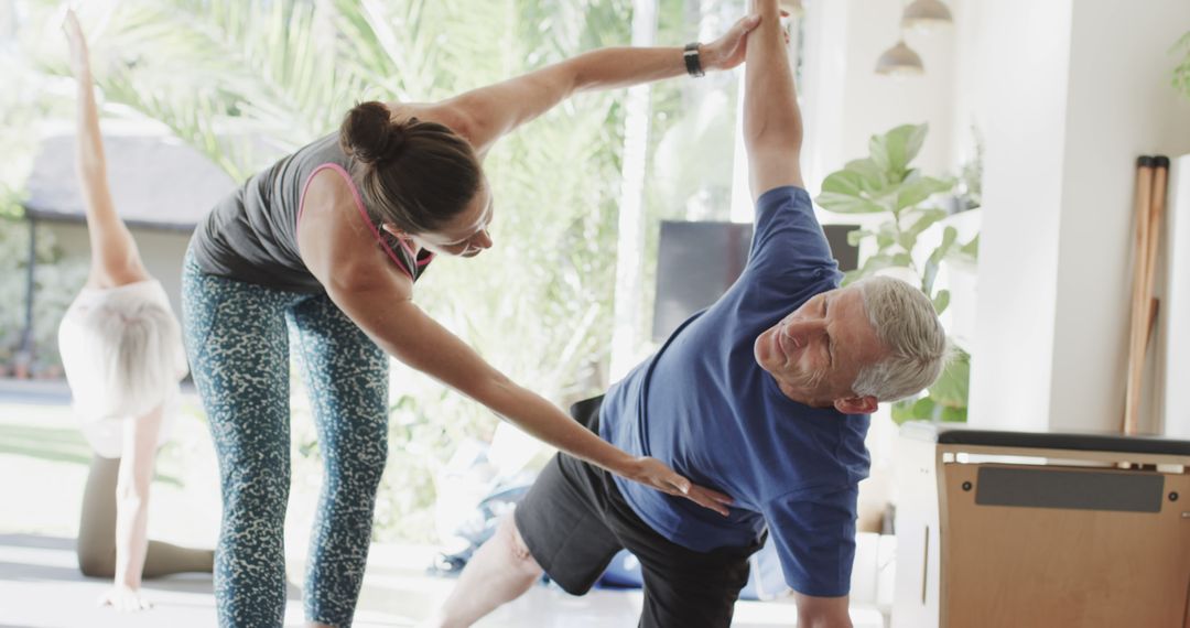 Senior Adults Practicing Yoga with Instructor at Home - Free Images, Stock Photos and Pictures on Pikwizard.com