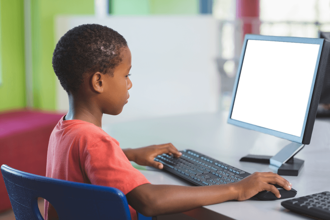 Young Student Engaged at Computer with Transparent Screen