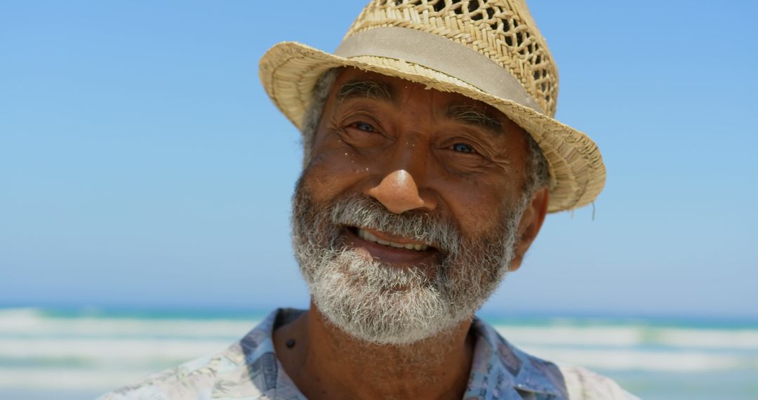 Elderly Man Enjoying Sunny Beach Day in Stylish Hat