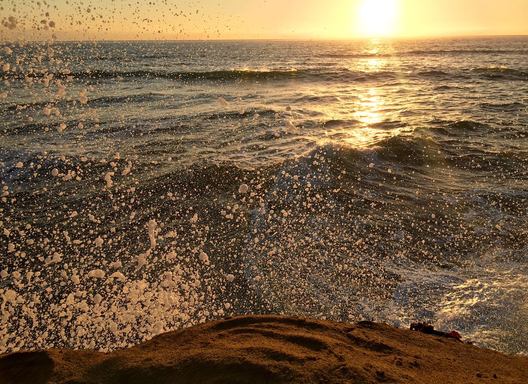 Sunset Over Ocean Waves with Spraying Water - Free Images, Stock Photos and Pictures on Pikwizard.com