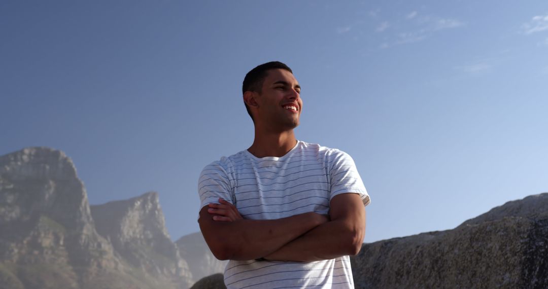 Young Man Enjoying Beach Scenery Under Clear Sky