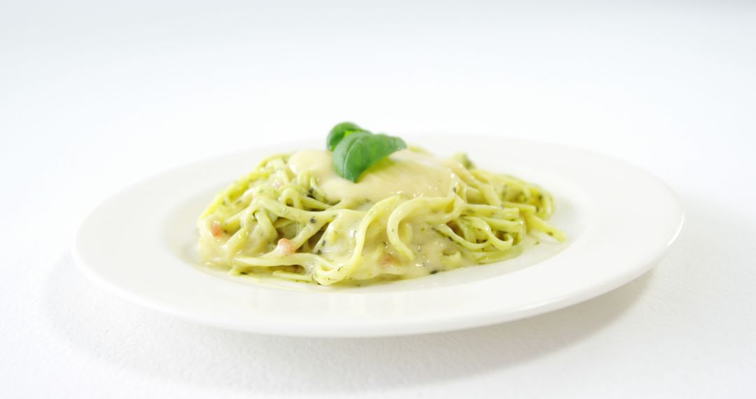 Creamy Basil Pasta on White Plate with Copy Space