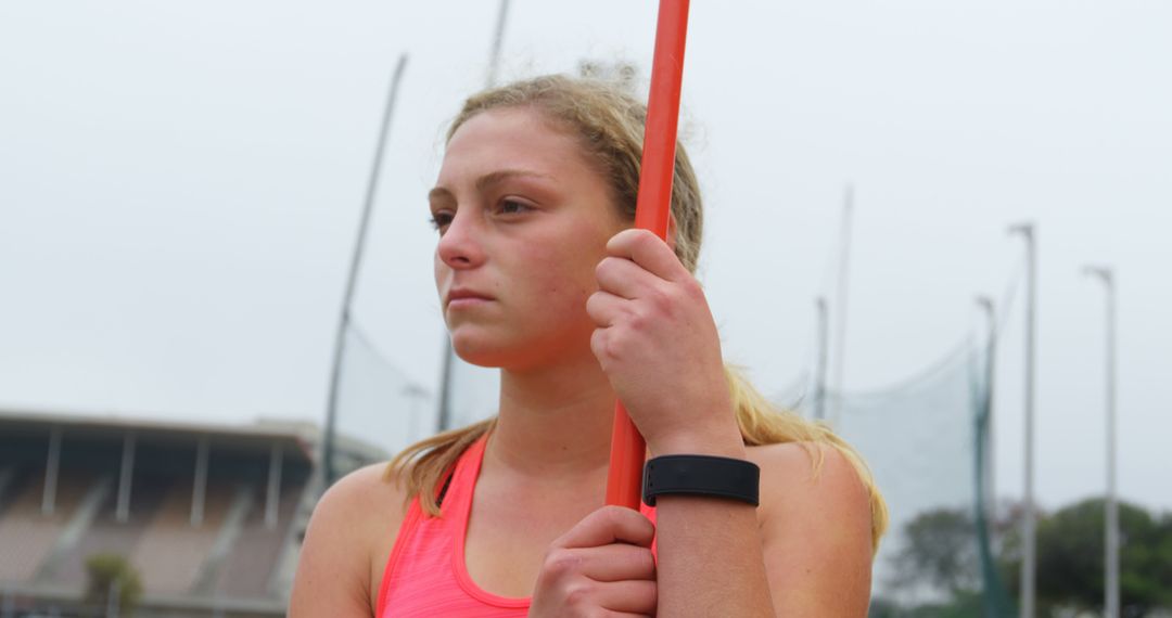 Female Athlete Preparing for Javelin Throw at Outdoor Track - Free Images, Stock Photos and Pictures on Pikwizard.com