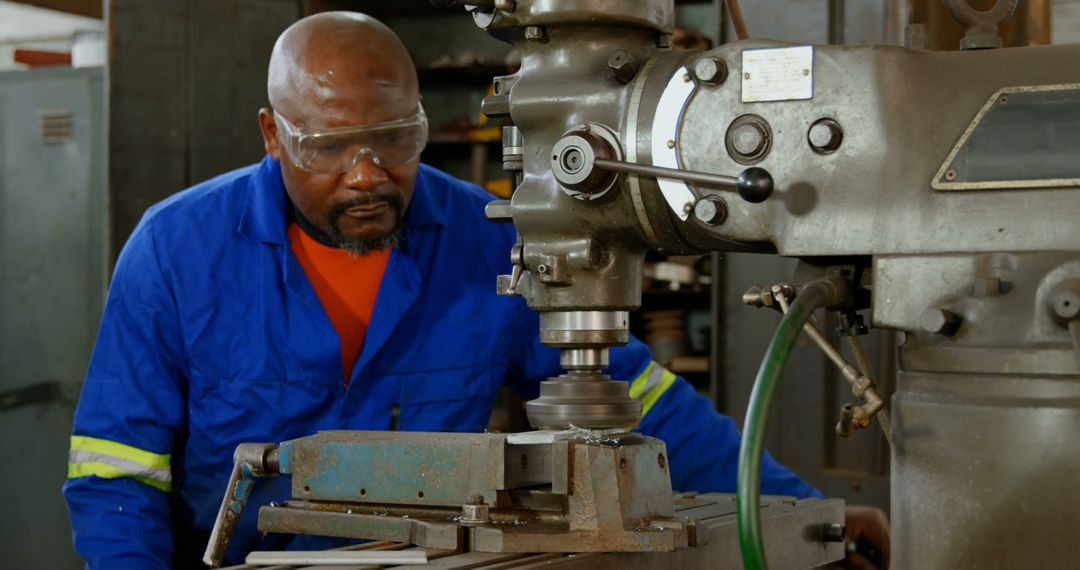 African American Engineer Operating Milling Machine in Workshop - Free Images, Stock Photos and Pictures on Pikwizard.com