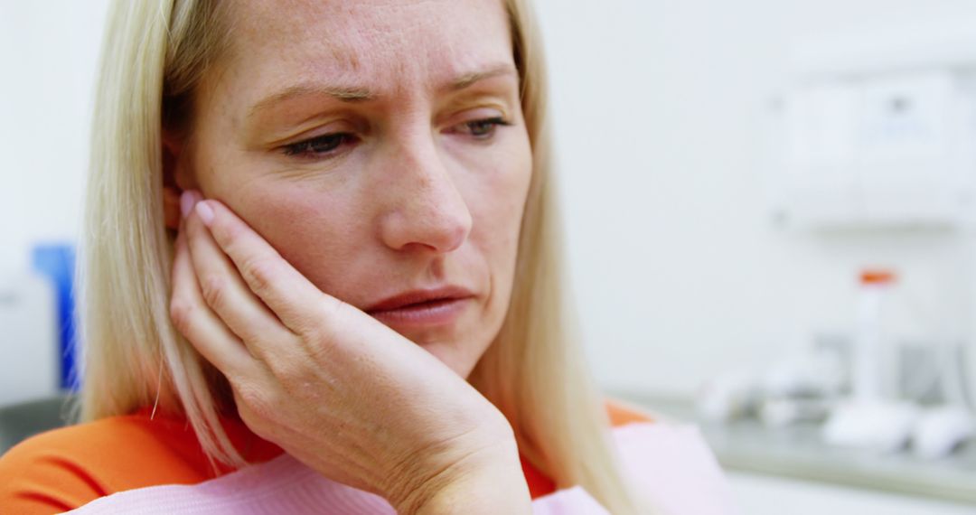 Woman Experiencing Toothache in Dental Clinic - Free Images, Stock Photos and Pictures on Pikwizard.com