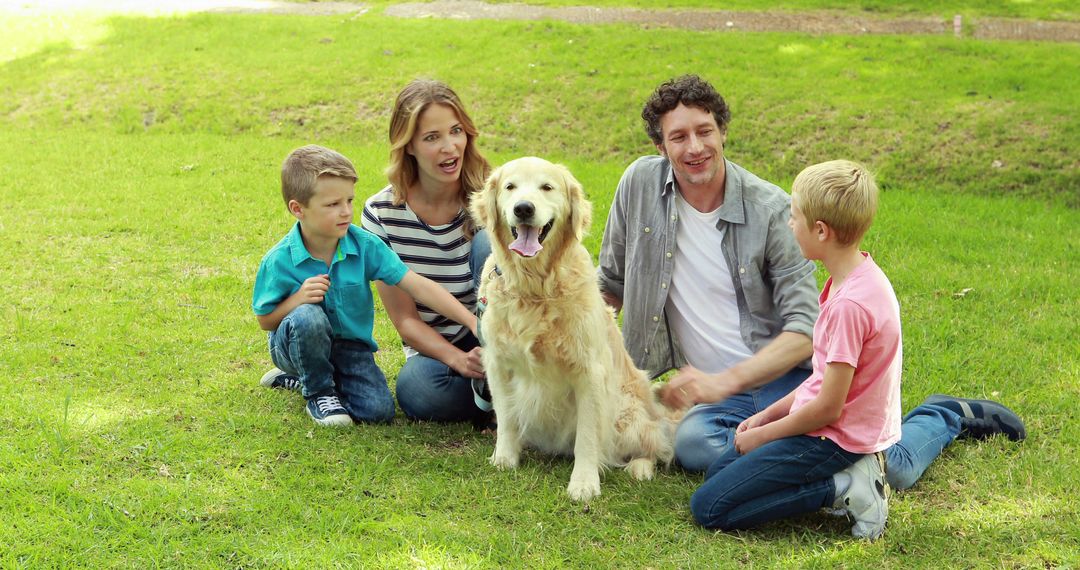 Happy Family Bonding with Golden Retriever in Park - Free Images, Stock Photos and Pictures on Pikwizard.com