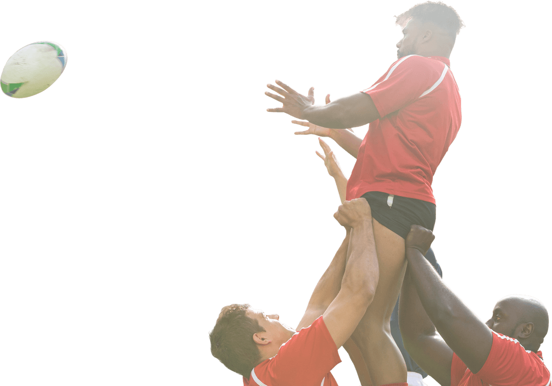 Diverse Rugby Team Lifting Teammate for Ball Catch Transparent Background