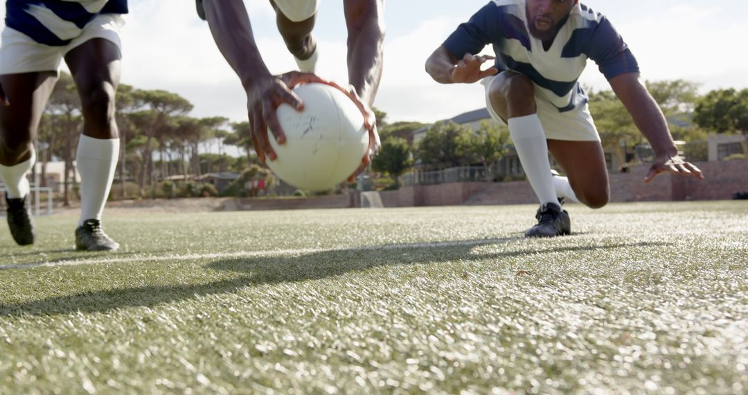 Dynamic Dive Rugby Action on Green Field