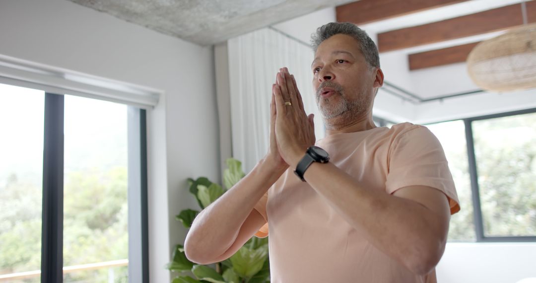 Middle-aged Man Practicing Mindfulness at Home - Free Images, Stock Photos and Pictures on Pikwizard.com