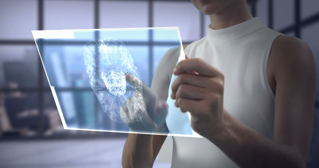 Woman Interacting with Transparent Touchscreen Technology in Modern Office - Free Images, Stock Photos and Pictures on Pikwizard.com