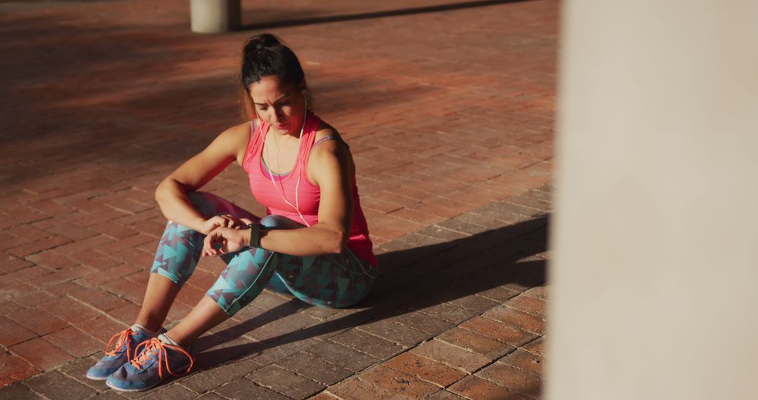 Woman Resting After Outdoor Workout in Colorful Athleisure - Free Images, Stock Photos and Pictures on Pikwizard.com