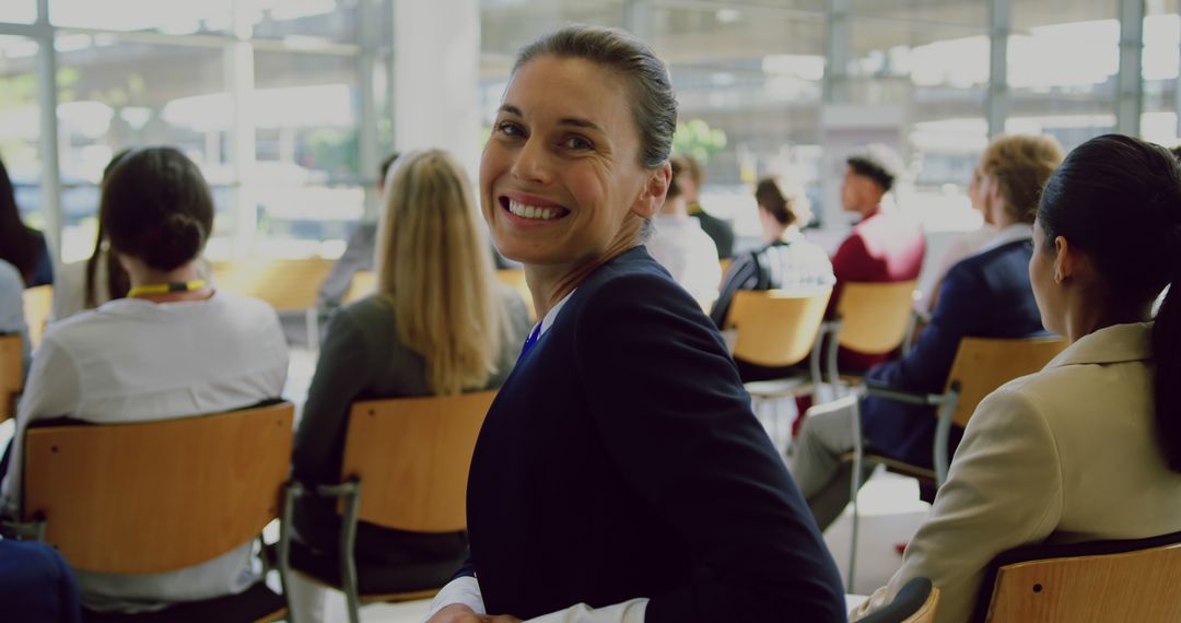 Confident Businesswoman Smiling During Presentation - Free Images, Stock Photos and Pictures on Pikwizard.com