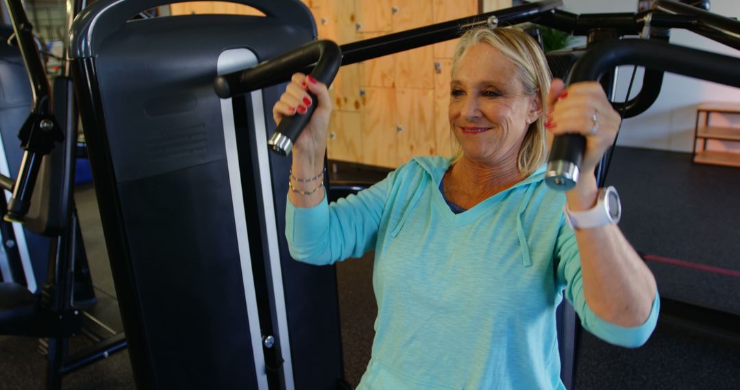 Senior Woman Engaging in Strength Training at Gym - Free Images, Stock Photos and Pictures on Pikwizard.com