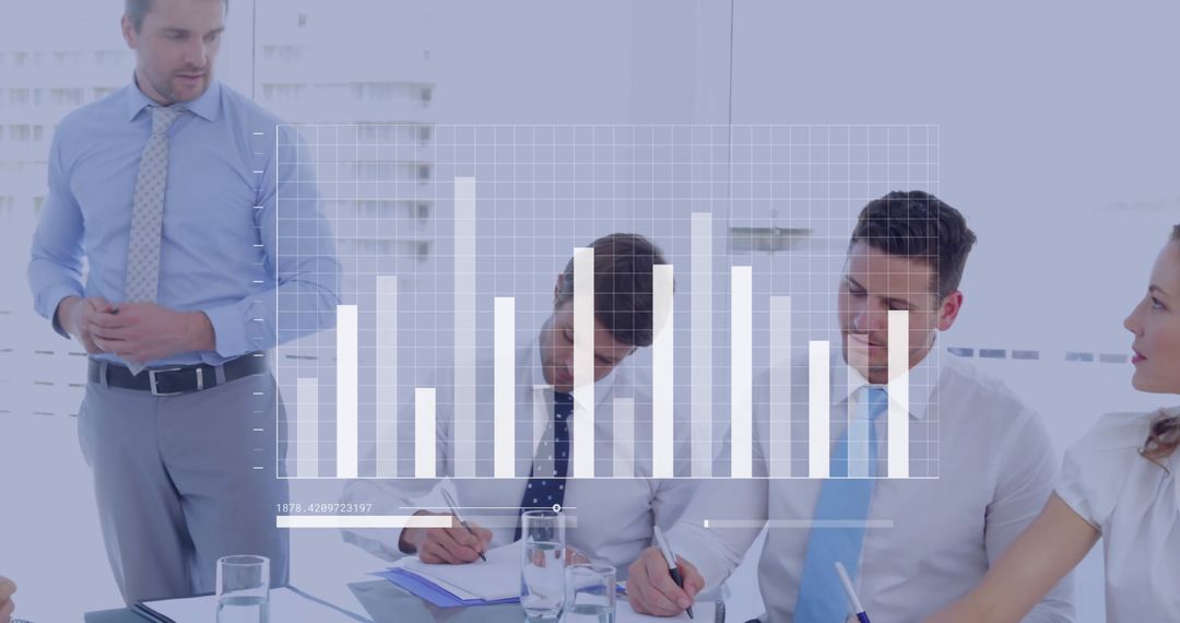 Diverse Professionals Collaborating with Digital Graph Overlay in Office