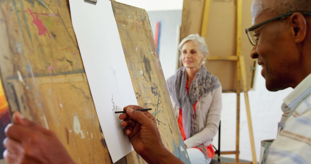 Elderly Artist Sketching Senior Woman in Art Class - Free Images, Stock Photos and Pictures on Pikwizard.com