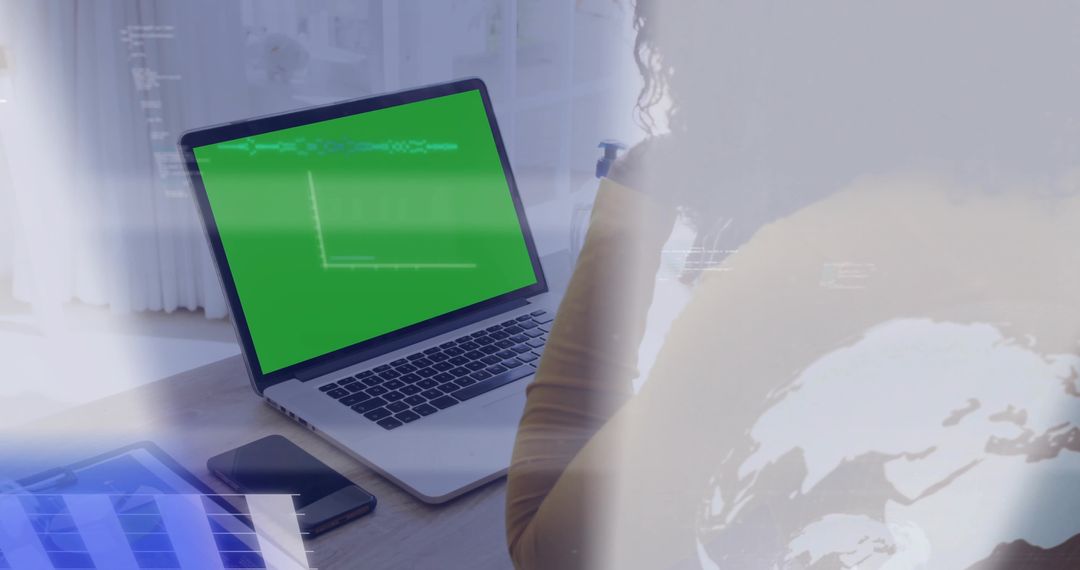 Woman using laptop with green screen and analytics overlays for remote work mockup
