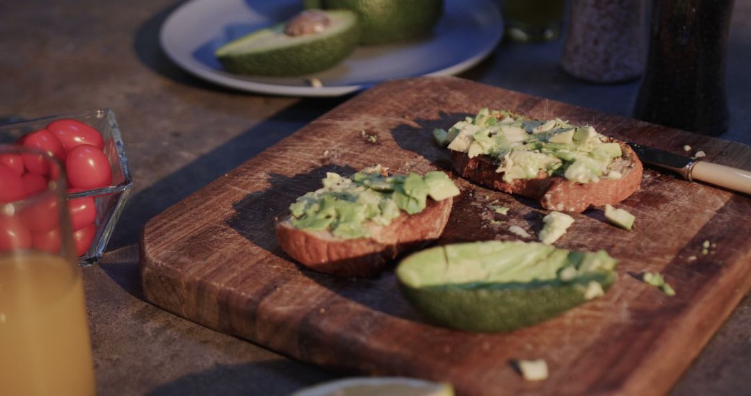 Preparing Avocado Toast on Wooden Board - Free Images, Stock Photos and Pictures on Pikwizard.com