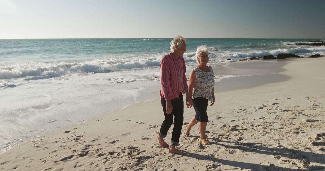 Senior Women Walking on Beach Enjoying Conversation - Free Images, Stock Photos and Pictures on Pikwizard.com