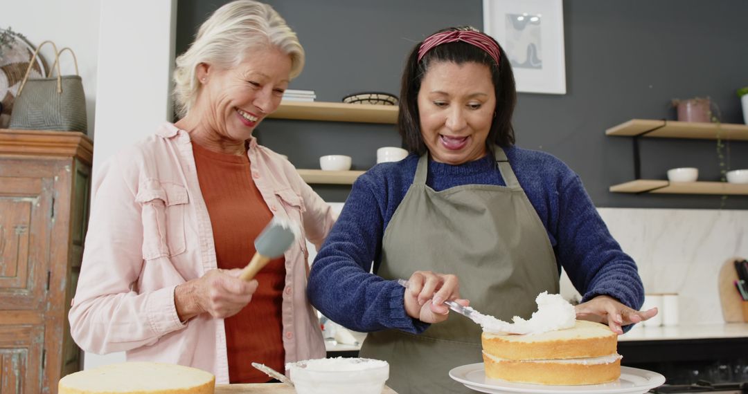 Senior Friends Collaboratively Frosting Cake in Rustic Kitchen