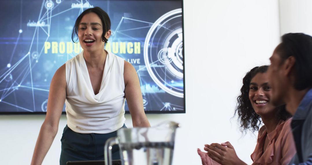 Diverse Team Celebrating Successful Product Launch in Modern Office