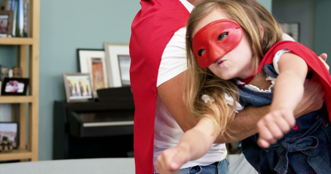 Father Playing Superhero with Daughter in Red Cape and Mask - Free Images, Stock Photos and Pictures on Pikwizard.com