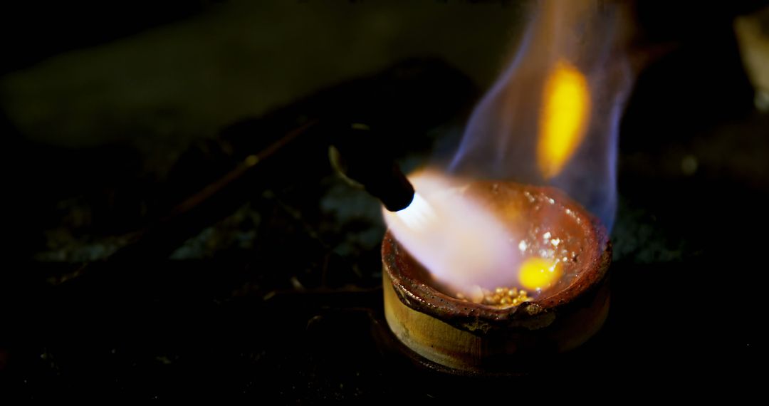 Gold Melting Process with Blazing Torch in Metal Workshop - Free Images, Stock Photos and Pictures on Pikwizard.com