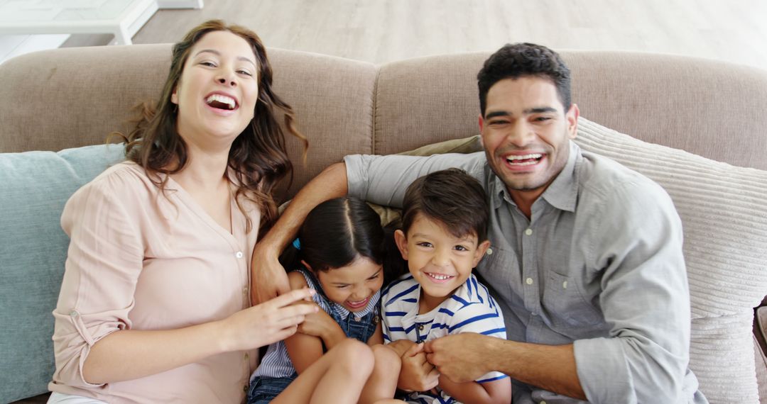 Cheerful Family Bonding at Home on a Cozy Living Room Sofa
