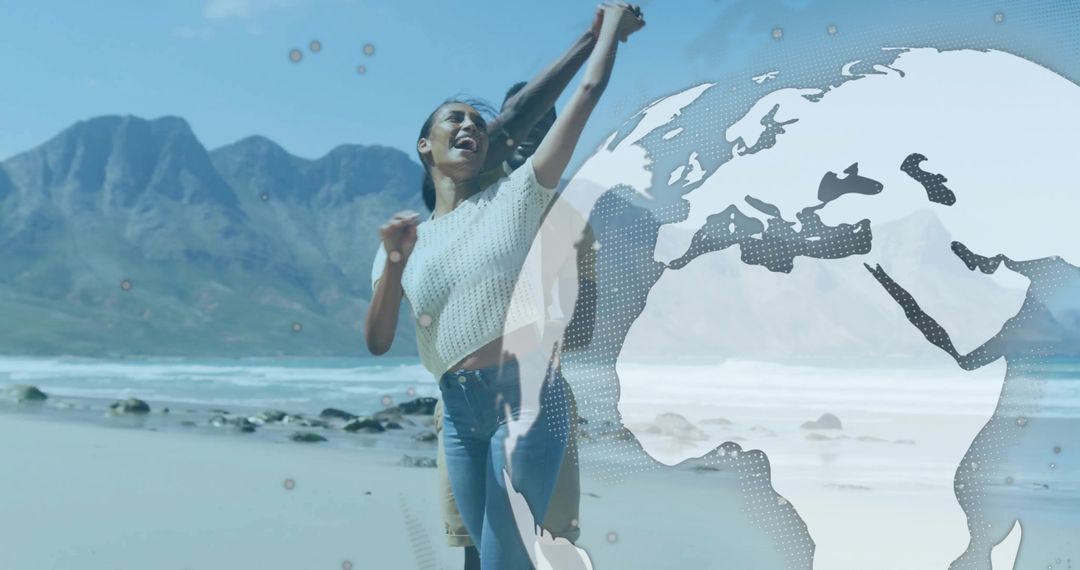 Joyful Couple Dancing on Beach with Globe Overlay