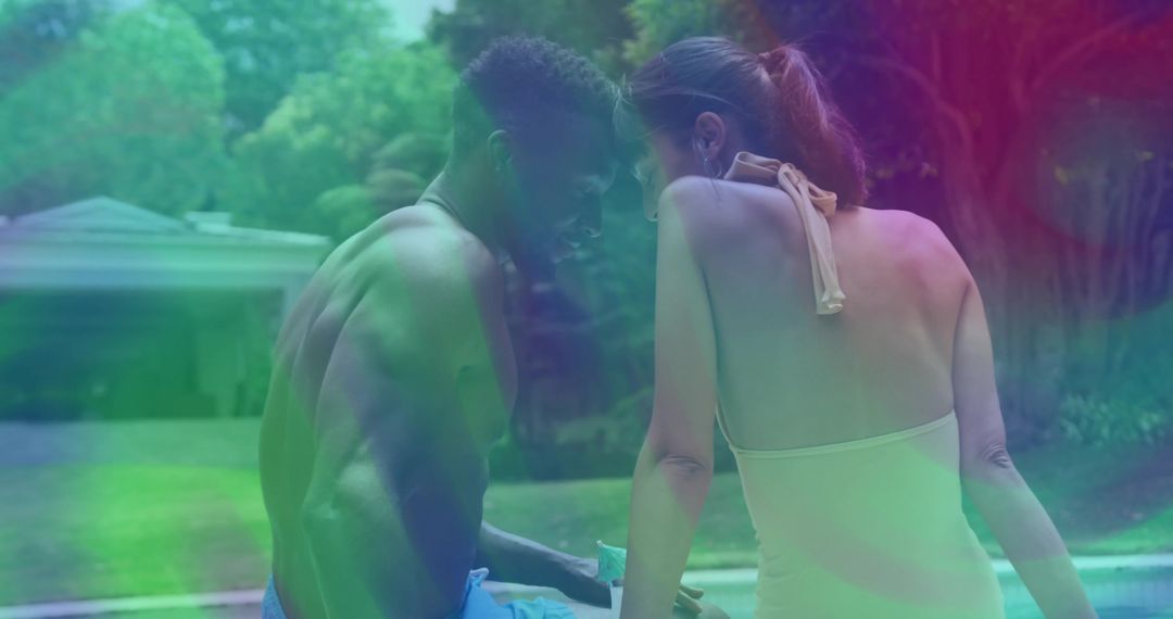 Couple Engaging by Pool during Summer Retreat