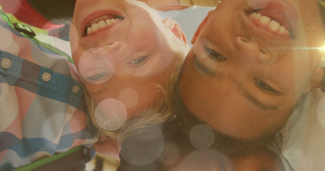 Joyful Diverse Boys Embracing Friendship Outdoors Bokeh Light Effect