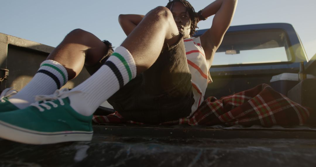 Person Relaxing in Truck Bed on Sunny Day - Free Images, Stock Photos and Pictures on Pikwizard.com