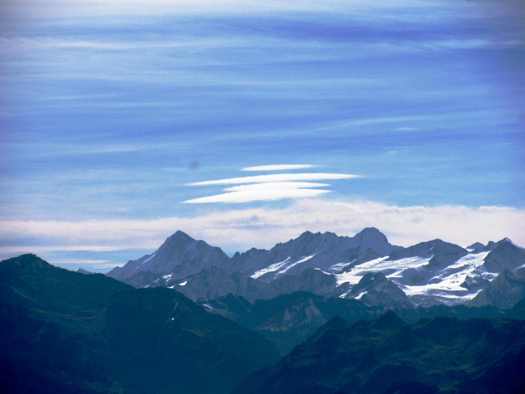 Majestic Snow-Capped Mountains Under a Clear Blue Sky - Free Images, Stock Photos and Pictures on Pikwizard.com