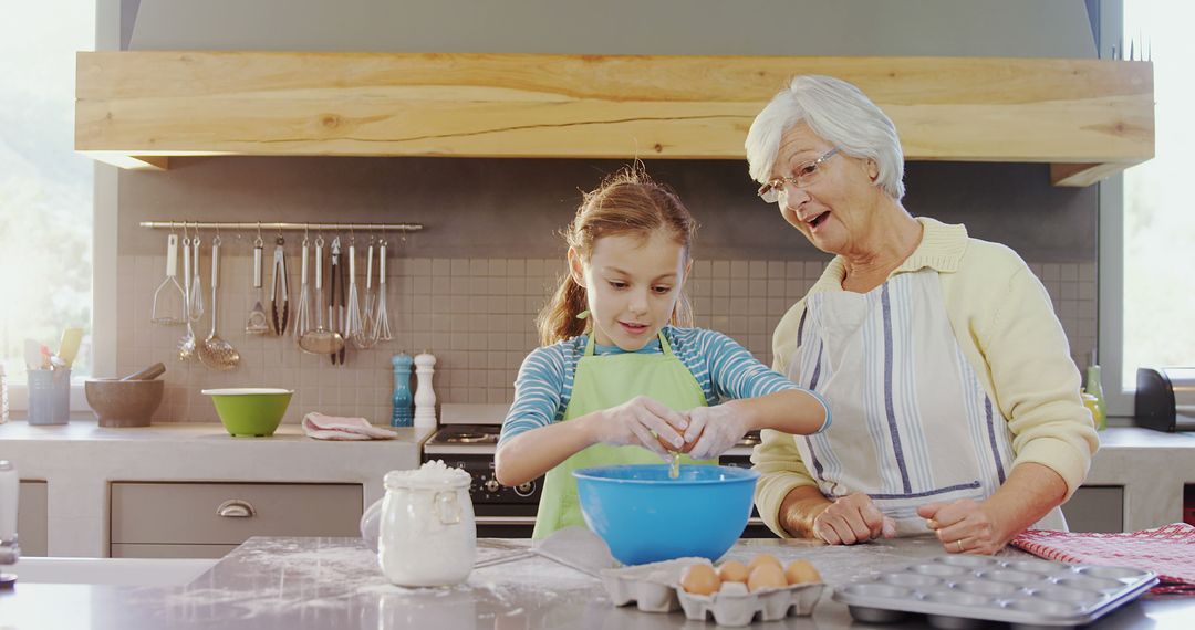 Senior Woman Bonding with Young Girl While Baking in Sunlit Kitchen - Free Images, Stock Photos and Pictures on Pikwizard.com