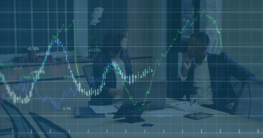 Diverse Business Team Analyzing Market Data with Graph Overlays