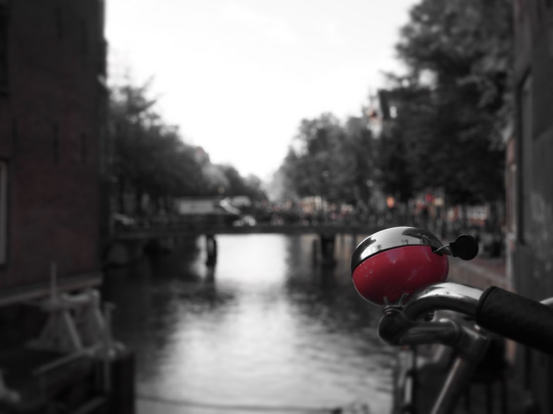 Close-Up of Red Bicycle Bell on Canal Bridge in Amsterdam - Free Images, Stock Photos and Pictures on Pikwizard.com