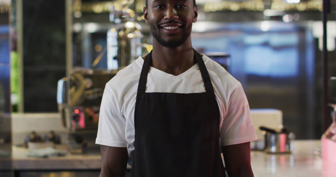 Smiling Barista Wearing Apron in Coffee Shop - Free Images, Stock Photos and Pictures on Pikwizard.com