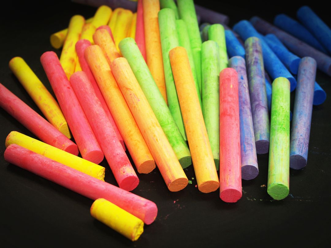 Colorful Chalk Sticks on Black Surface - Free Images, Stock Photos and Pictures on Pikwizard.com