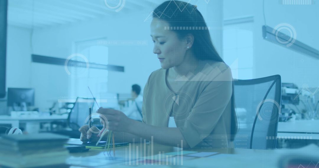 Businesswoman Analyzing Data in Modern Office with Technology Interface